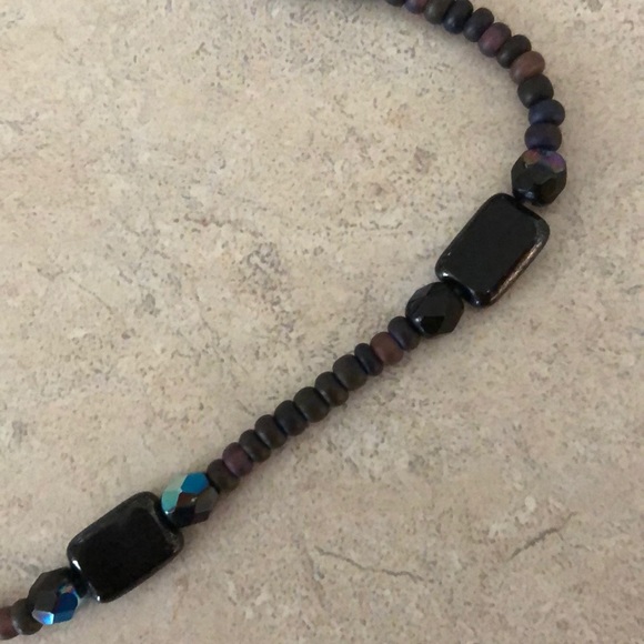 This fun necklace is strung on a stretchy twine - Picture 4 of 4